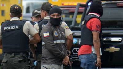 Ecuador TV studio taken over live on air by masked people brandishing guns - cnbc.com - Ecuador