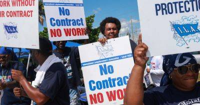 Dockworkers' Union To Suspend Strike Until Jan. 15 To Allow Time To Negotiate New Contract