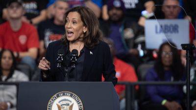 In Michigan, Harris hits back against Trump over his electric car attack lines