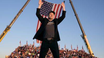 Elon Musk makes his first appearance at a Trump rally and casts the election in dire terms