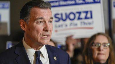 Tom Suozzi - Mazi Pilip - Santos - In New - Race to succeed George Santos in Congress reaches stormy climax in New York’s suburbs - apnews.com - county George - city New York - state Florida - New York - city Santos, county George