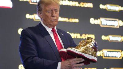 Trump hawks $399 branded shoes at ‘Sneaker Con,’ a day after a $355 million ruling against him