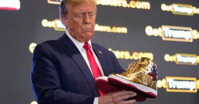 Donald J.Trump - Chris Cameron - Reeling From $450 Million Penalty, Trump Hawks $400 Shoes - nytimes.com - New York - state Michigan - city Philadelphia