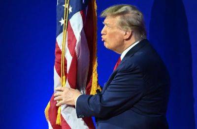 Trump kisses and hugs flag and does strange swaying to music ahead of CPAC speech