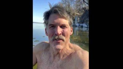 Shirtless US Senate candidate submerges himself in Wisconsin lake, issues challenge to opponent