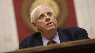 West Virginia Republican governor signs budget, vows to bring back lawmakers for fixes