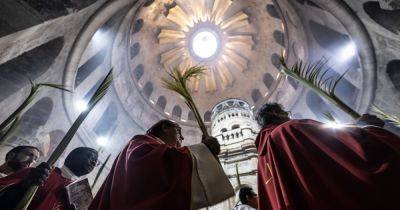 Thousands of Faithful Celebrate Palm Sunday In Jerusalem Against A Backdrop Of War
