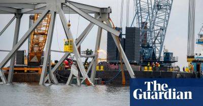 Wes Moore - Pete Buttigieg - Engineers begin removing Baltimore Key Bridge’s mangled wreckage - theguardian.com - Usa - state Ohio - state Maryland - state Tennessee - state Kentucky - city Baltimore