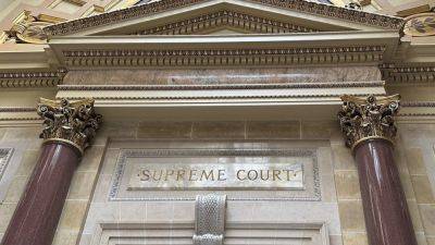 Wisconsin Supreme Court to hear arguments in Democratic governor’s suit against GOP-led Legislature
