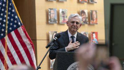 Garland speaks with victims’ families as new exhibit highlights the faces of gun violence