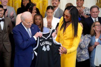 Joe Biden - Kamala Harris - Via AP news wire - President Joe Biden cheers the Las Vegas Aces and women's basketball - independent.co.uk - Usa - Washington - county Liberty - city Las Vegas