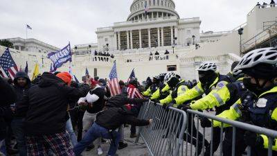 Donald Trump - Mike Pence - Harry Dunn - One man was a Capitol Police officer. The other rioted on Jan. 6. They’re both running for Congress - apnews.com - Georgia - state West Virginia - state Maryland - Charleston, state West Virginia
