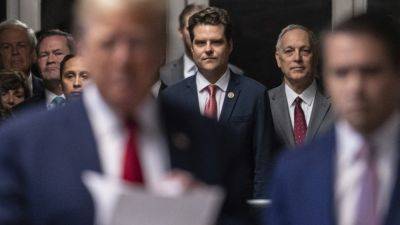 Matt Gaetz evokes ‘standing by’ language adopted by Proud Boys as he attends court with Donald Trump