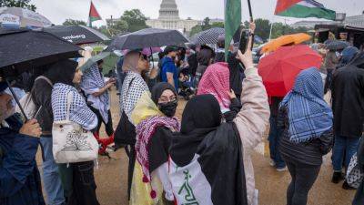 Joe Biden - Hundreds of pro-Palestinian protesters rally in the rain in DC to mark a painful present and past - apnews.com - Usa - Washington - Israel - Palestine - city Atlanta