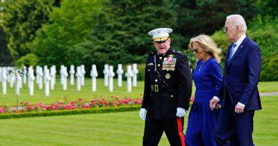 In visit to military cemetery in France, Biden attempts to draw contrast with Trump