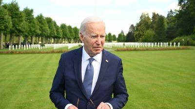 Biden visits a military cemetery that Trump reportedly said was 'filled with losers'