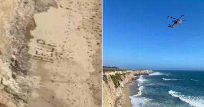 Michelle Butterfield - Stranded kite surfer rescued after spelling out ‘HELP’ with rocks - globalnews.ca - state California - county Santa Cruz