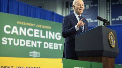 Americans are split on Biden’s student loan work, even those with debt, an AP-NORC poll finds