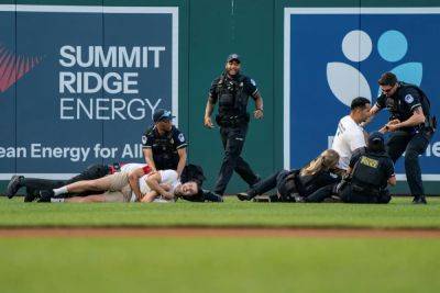 James Liddell - Climate protesters tackled on field at Congressional baseball game - independent.co.uk - Usa - Israel - Palestine - county Park