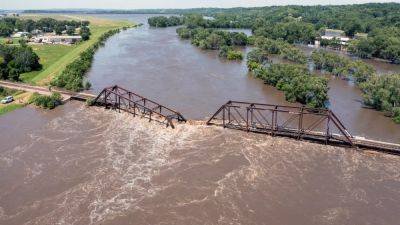 More rain possible in deluged Midwest as flooding kills 2, causes water to surge around dam - independent.co.uk