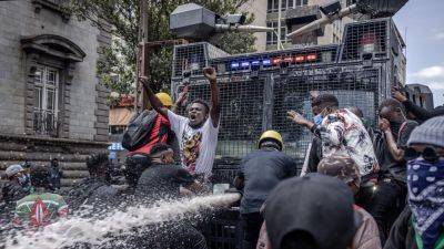 Pictures show police clashing with anti-tax protesters in Kenya's capital