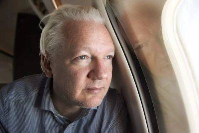 Julian Assange flies to remote Pacific island in plea deal with US over espionage
