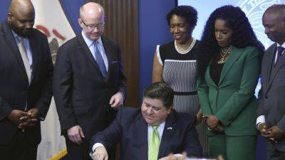 J.B.Pritzker - Pritzker signs $53.1B Illinois budget, defends spending with ‘sustainable long-term growth’ - apnews.com - state Pennsylvania - state Illinois - city Chicago - city Springfield, state Illinois
