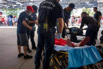 11 Trump backers taken to hospital after falling ill in extreme heat waiting for Arizona rally to start