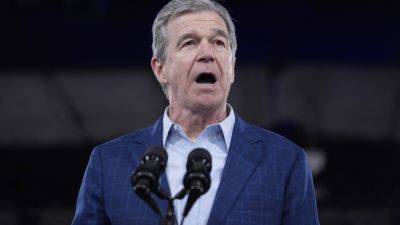 Joe Biden - Bill - Makiya Seminera - Vaping regulations, DMV changes among bills signed by North Carolina Gov. Roy Cooper - apnews.com - state North Carolina - Raleigh, state North Carolina