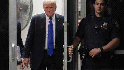 Joe Biden - Donald Trump - BILL BARROW - LINLEY SANDERS - Americans are split over whether Trump should face prison in the hush money case, AP-NORC poll finds - apnews.com - Usa - Washington