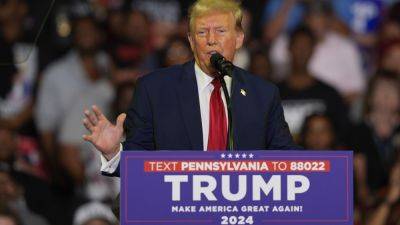 Joe Biden - Donald Trump - Trump disavows Project 2025 transition plan after a key official calls for a new American Revolution - apnews.com - Usa - city Philadelphia