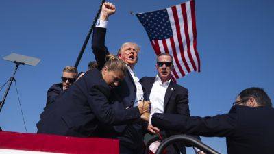 Donald Trump - Kevin Breuninger - Photos show Trump with blood on his face after shots fired at rally - cnbc.com - state Pennsylvania