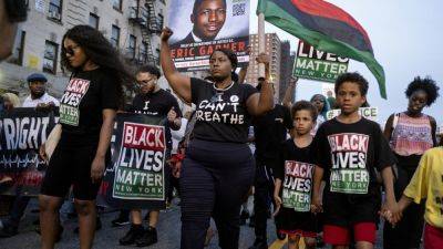 George Floyd - Michael Brown - ‘I can’t breathe': Eric Garner remembered on the 10th anniversary of his chokehold death - apnews.com - city New York - New York - state Missouri - city Minneapolis
