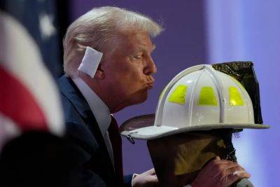 Donald Trump - Alina Habba - Melania Trump - Eric Trump - Tucker Carlson - Joe Sommerlad - Corey Comperatore - RNC 2024 live: Trump kisses helmet of firefighter killed during rally shooting as he flashes $1m check in speech - independent.co.uk - Usa - state Pennsylvania - city Milwaukee - county Butler