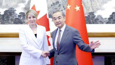 Canada, China pledge to mend relations after foreign affairs ministers meet in Beijing