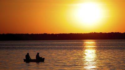 Wisconsin agrees to drop ban on carrying firearms while fishing following challenge
