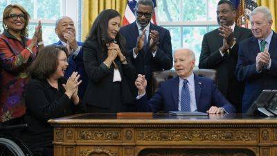 Joe Biden - Donald Trump - Kamala Harris - AAMER MADHANI - ZEKE MILLER - Biden signs order to establish 1908 Springfield race riot monument as he looks to burnish legacy - apnews.com - Usa - Washington - state Illinois - city Springfield, state Illinois