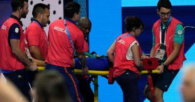 Olympic Swimmer Collapses Poolside Moments After Finishing Heat
