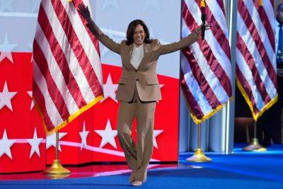 Joe Biden - Donald Trump - Kamala Harris - Alex Woodward - Doug Emhoff - Tim Walz - Kamala Harris makes surprise appearance on first night of DNC: ‘We are moving forward’ - independent.co.uk - state Minnesota - city Chicago