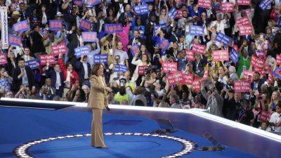 Joe Biden - Donald Trump - Hillary Clinton - WILL WEISSERT - Doug Emhoff - Tim Walz - Joe Biden’s exit, talk of the glass ceiling, a civil rights hero. Takeaways from Day 1 of the DNC - apnews.com - state Minnesota - state Indiana - city Chicago - county Harris