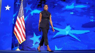 Michelle Obama - Danielle Wallace - Michelle Obama wore nearly $3K pantsuit to DNC while touting her parents were 'suspicious' of the wealthy - foxnews.com - Usa - city New York - New York - city Chicago