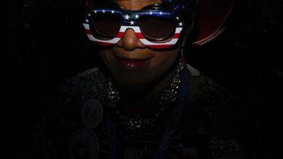 Using some ingenuity with a flash, an AP photographer gets to the red, white and blue of a portrait