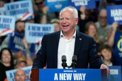 Joe Biden - Donald Trump - Kamala Harris - Taylor Swift - Oliver OConnell - Tim Walz - Walz hails ‘fellow cat owner Taylor Swift’ as he quotes ‘Tortured Poets’ song - independent.co.uk - state Pennsylvania - Washington - state Minnesota - state North Carolina - state Michigan - state Wisconsin - city Grand Rapids - city Lansing