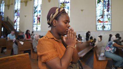 Donald Trump - Haitians in Ohio find solidarity at church after chaotic week of false pet-eating claims - apnews.com - state Ohio - Haiti - city Springfield, state Ohio