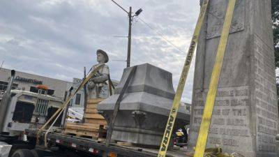 A Mississippi Confederate monument covered for 4 years is moved - apnews.com - county George - state Mississippi - county Floyd - Grenada