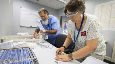 Several states are making late changes to election rules, even as voting is set to begin